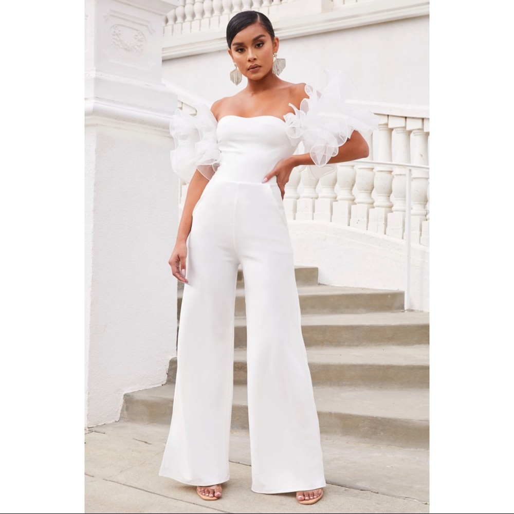 Club L Ivory organza ruffle sleeve jumpsuit.